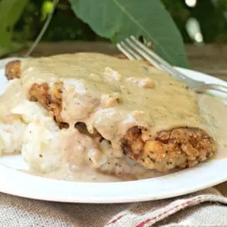 a photo of The Secret to Perfect Chicken Fried Steak with sunlight shining on the gravy