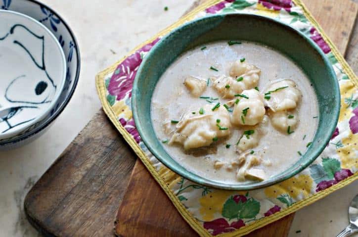 Overhead photo of Homemade Chicken and Drop Dumplings with fresh chive sprinkles