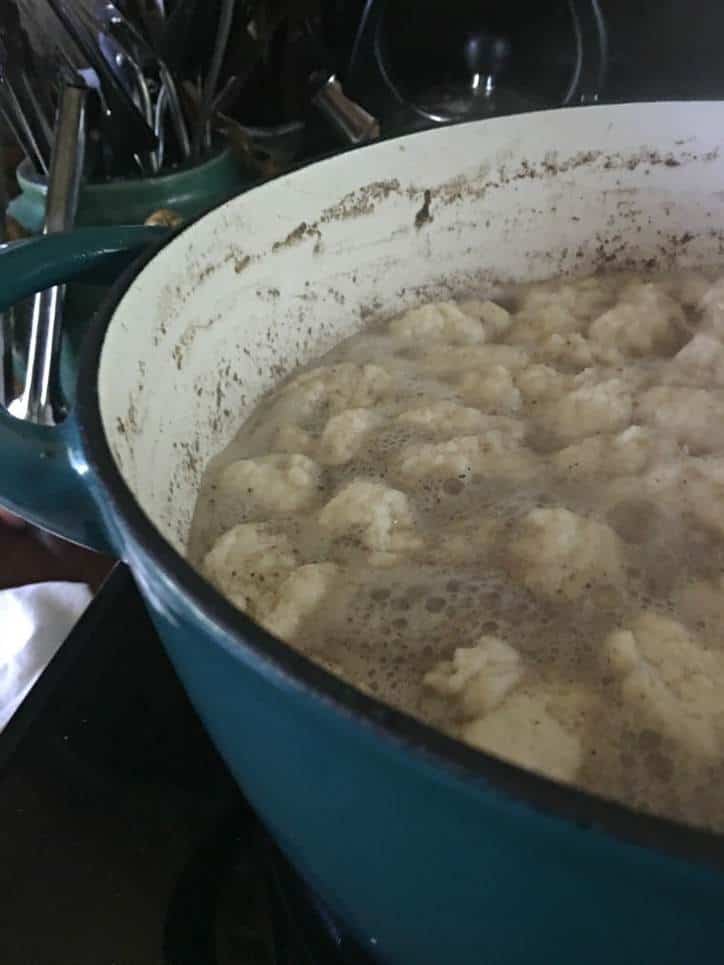 An upclose look at the dumplings as they cook on the stovetop. See how they float and kind of bubble up?