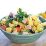 A side view of a bowl of pasta salad for the post ALL THE SECRETS TO PERFECT PASTA SALAD