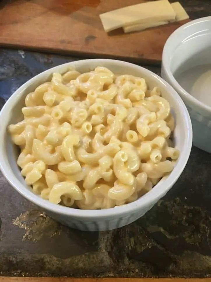macaroni and cheese noodles filled to top of the ramekin