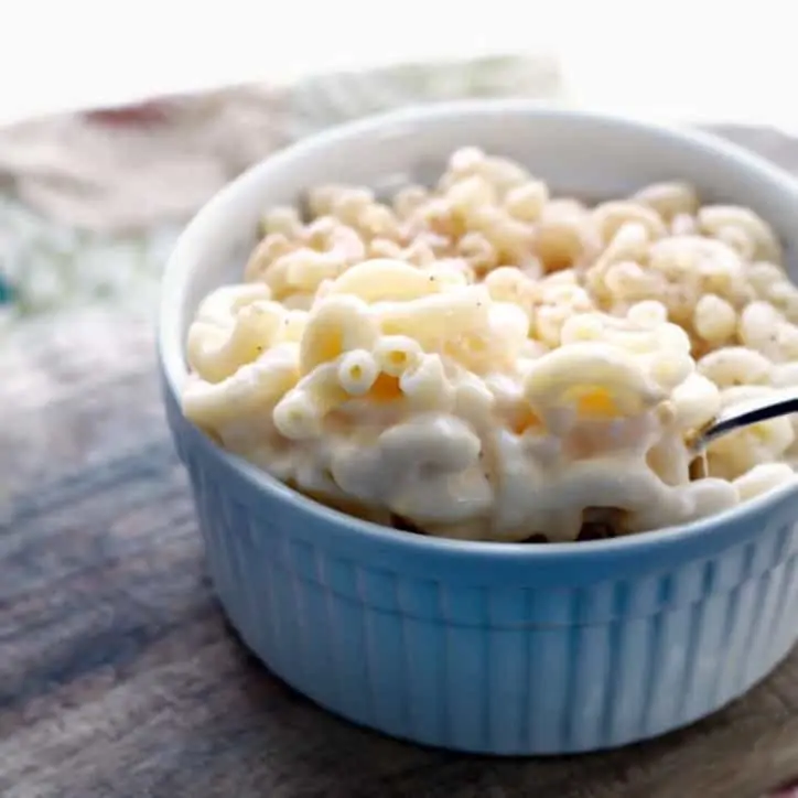 A side shot of the ramekin showing the cheesy center of Death by Macaroni and Cheese