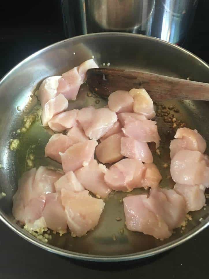 A photo of the chicken cooking in the pan
