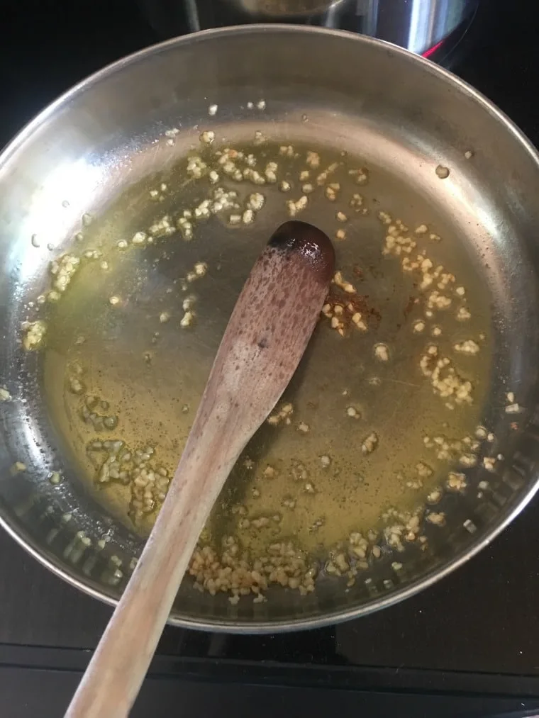 A photo of garlic saute in pan