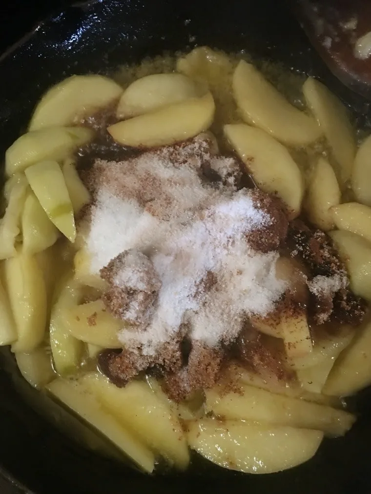 a photo of the cooked apples with the sugars added on top