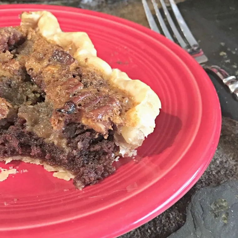 View of the inside of a slice of Fudge Chocolate Pecan Pie