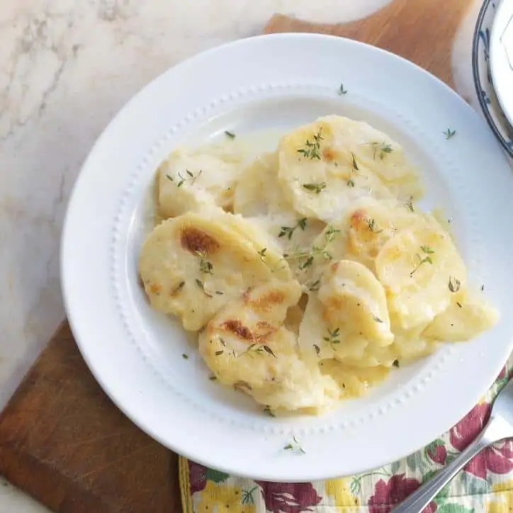 overhead shot that is further away of THE SECRET TO PERFECT EVERY TIME AU GRATIN POTATOES