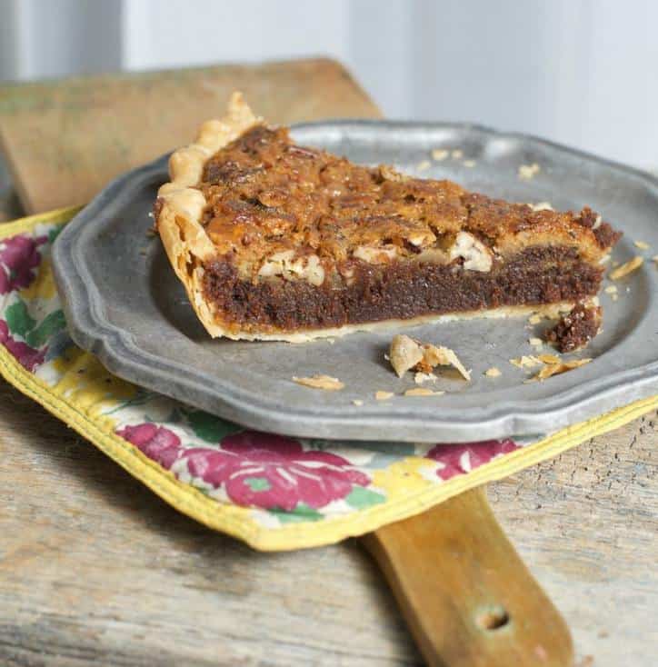 Side view of a slice of Fudge Chocolate Pecan Pie