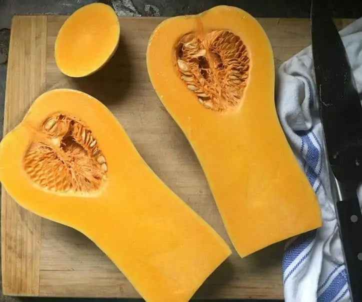 A photo of the bright yellow and orange colored flesh on the inside of a butternut squash