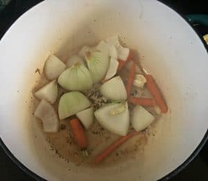 A photo of the onions and carrots browning for Lamb Shanks in Wine Sauce