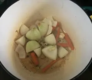 A photo of the onions and carrots browning for Lamb Shanks in Wine Sauce