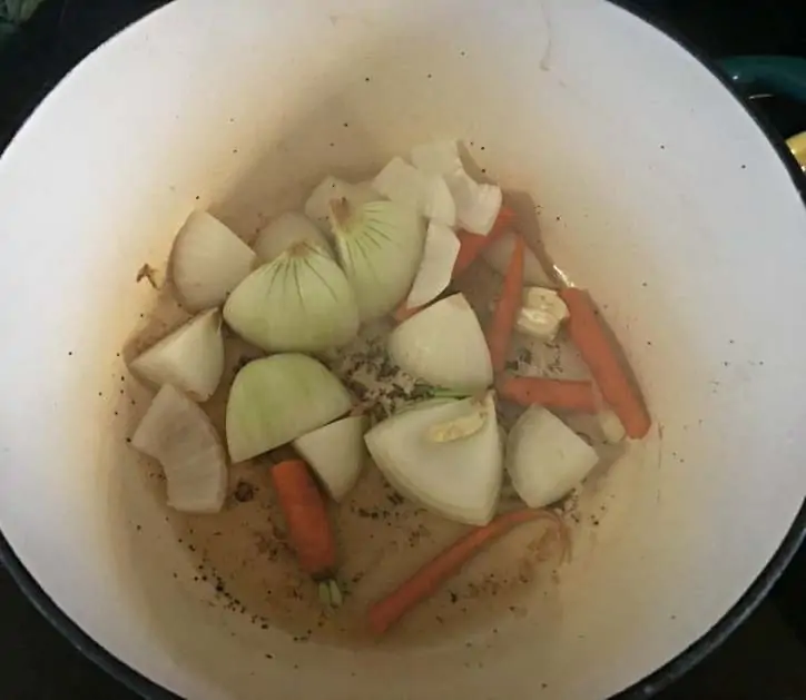 A photo of the onions and carrots browning in pan