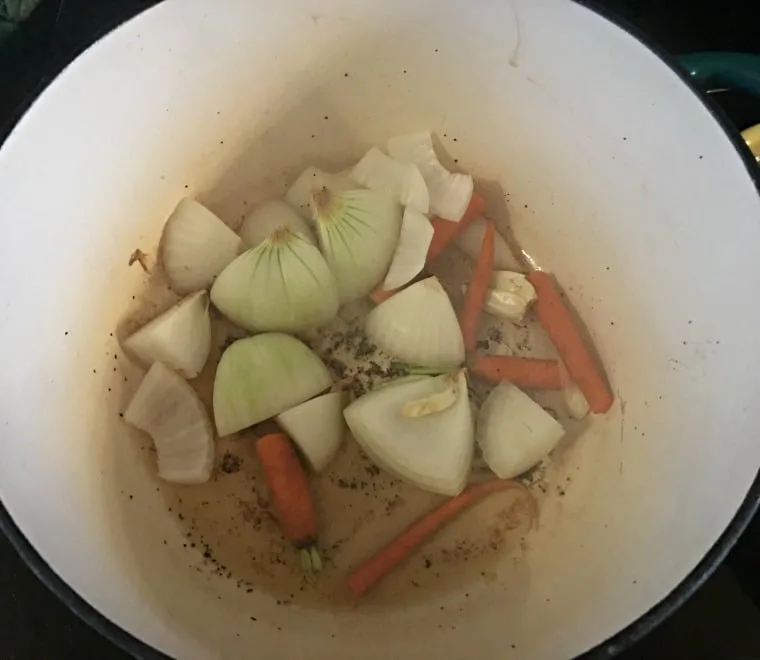 A photo of the onions and carrots browning in pan