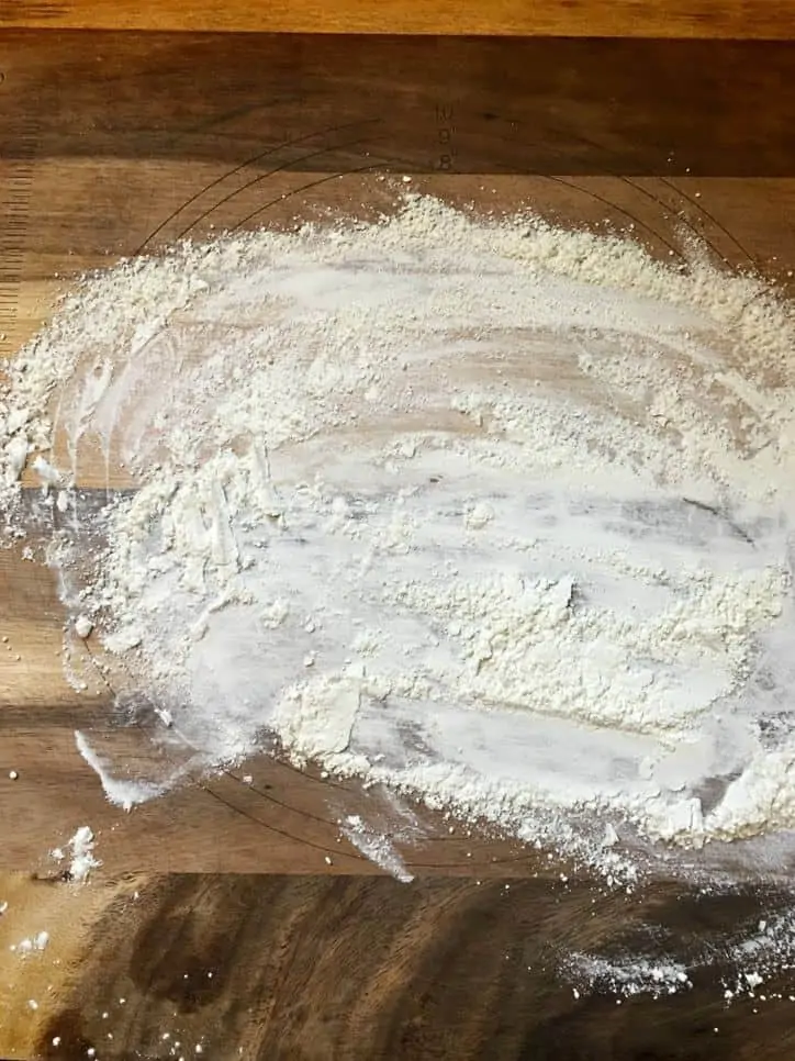 A photo of a floured bread board for Southern Buttermilk Biscuits