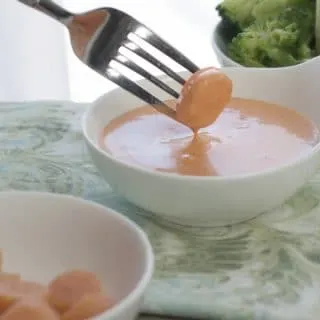 Shrimp sauce with a carrot disk being dipped in for the post Japanese White Sauce