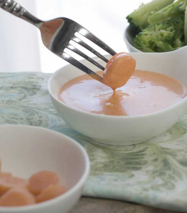 Shrimp sauce with a carrot disk being dipped in for the post Japanese White Sauce