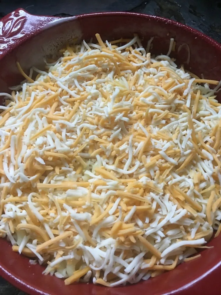A photo of the dish filled with noodles and cheese for easy baked macaroni and cheese