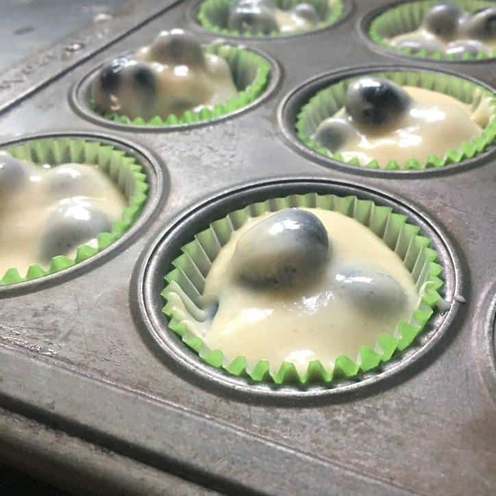 A photo of the batter in the muffin cup up close! BLUEBERRY MUFFINS WITH CRUMBLE TOP