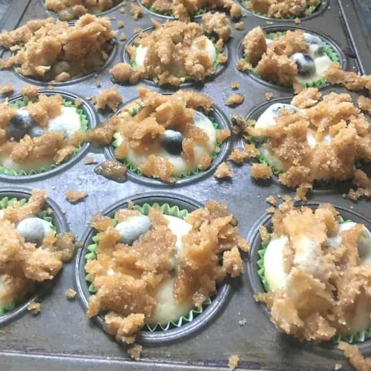 A photo of the muffins ready to bake for BLUEBERRY MUFFINS WITH CRUMBLE TOP