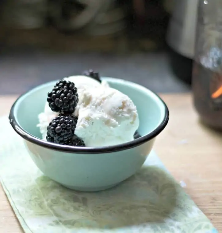 A photo from a distance of pickled blackberries, without a spoon