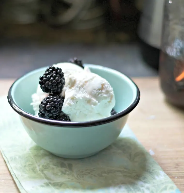 A photo from a distance of pickled blackberries, without a spoon