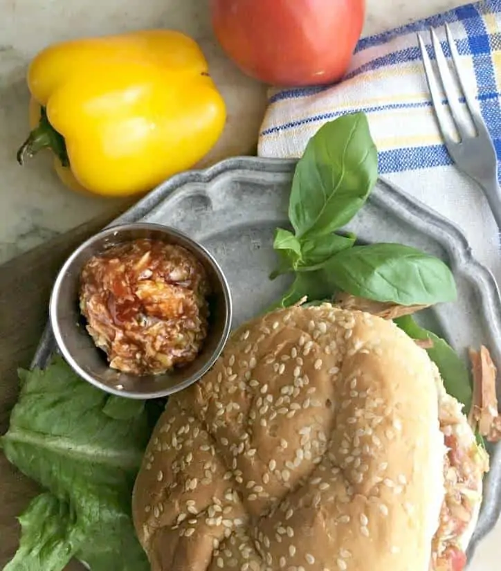 An overhead shot of a BBQ sandwich with Easy Southern Red Barbecue Slaw