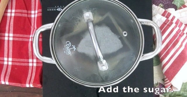 sauce pan with lid on, tea bag visible through glass lid for The Secret to Perfect Southern Sweet Tea