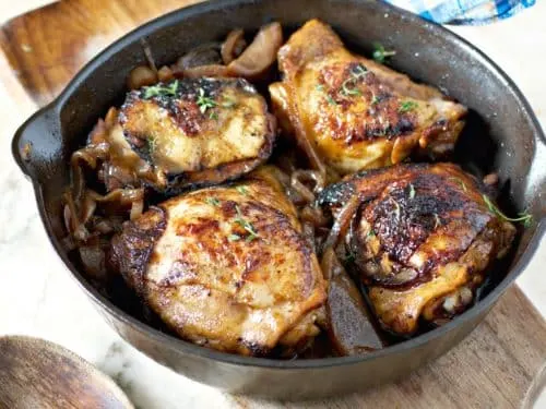 Easy Braised Chicken Thighs on cutting board