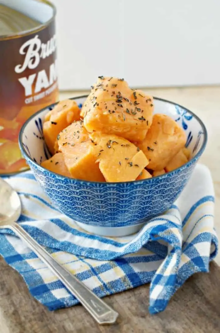 A photo from the side of a bowl of How to Cook Canned Yams on the Stove