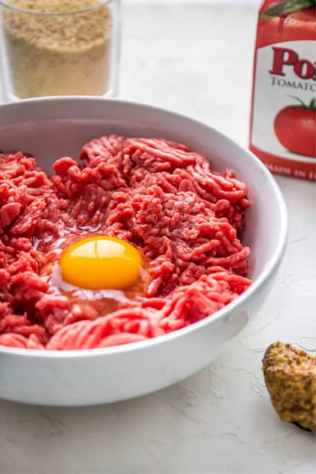 the egg in the hamburger for tasty easy meatloaf