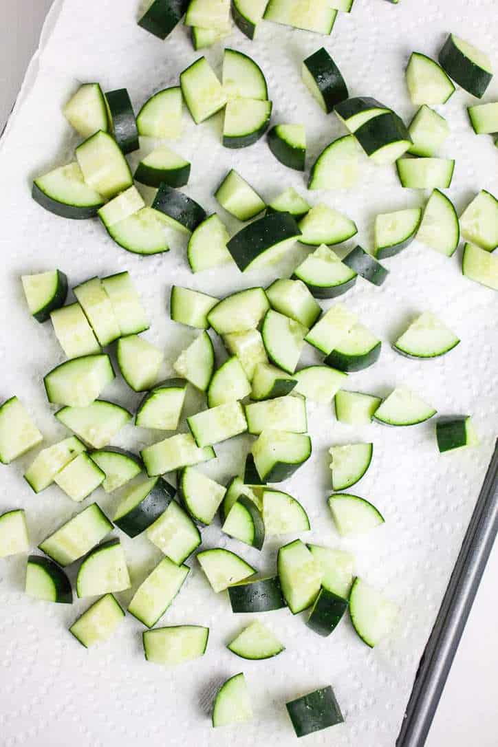 A photo of the cucumbers cut into pie shape pieces for zesty Cucumber and Tomato Salad
