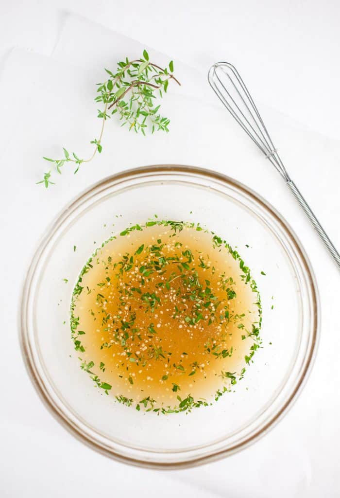 A photo of the dressing in a bowl with the whisk