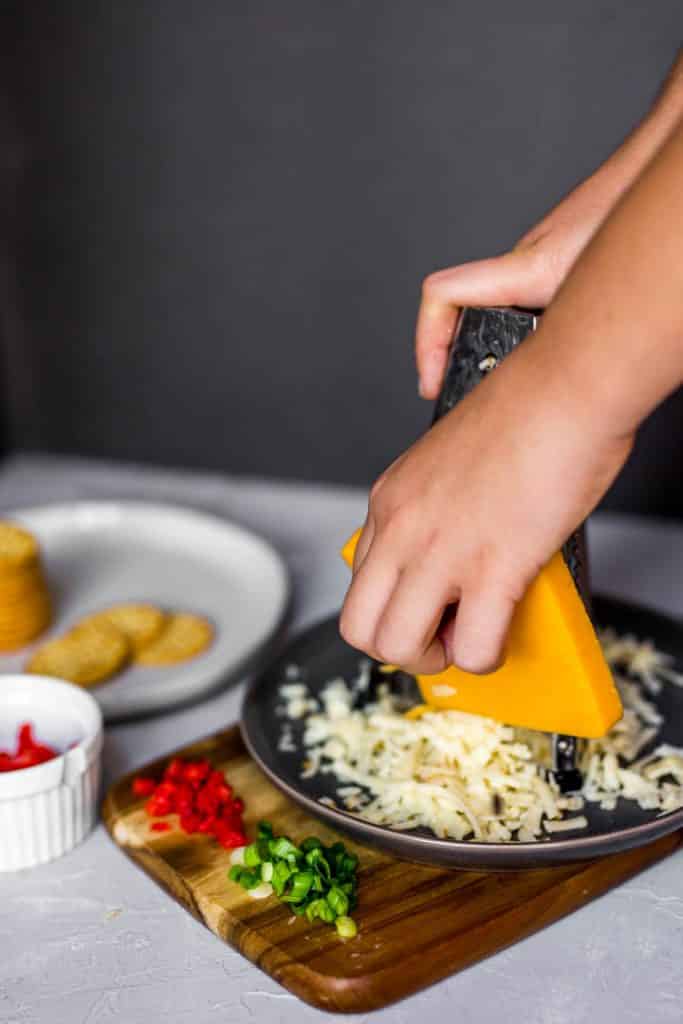 Grating cheese for Southern Hot Pimento Cheese