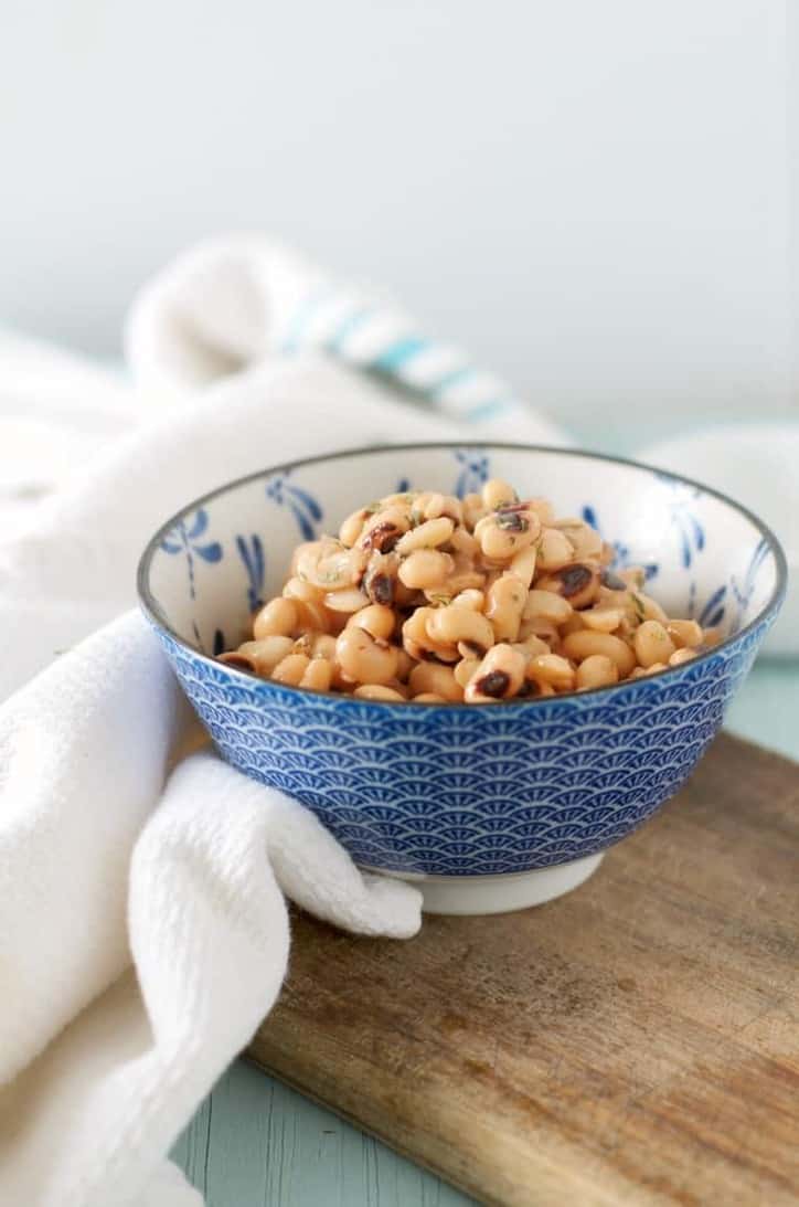 A side view of a bowl of black eyed peas