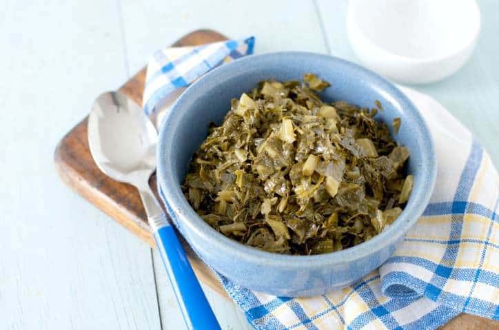 A close up photo from above of HOW TO COOK CANNED COLLARD GREENS