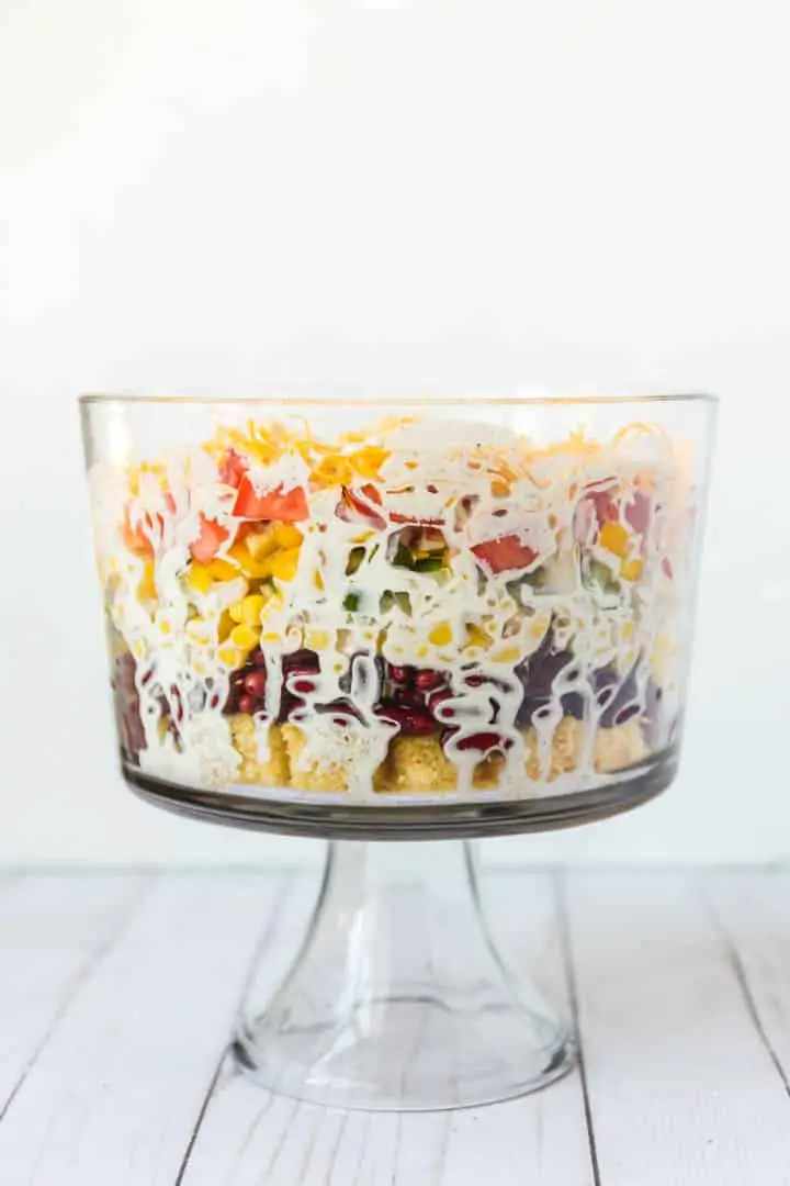 A photo of the side of the cornbread salad in the trifle bowl Southern Cornbread Salad