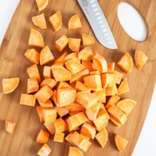 A sweet potato cut up in 1 inch pieces for southern sweet potato casserole