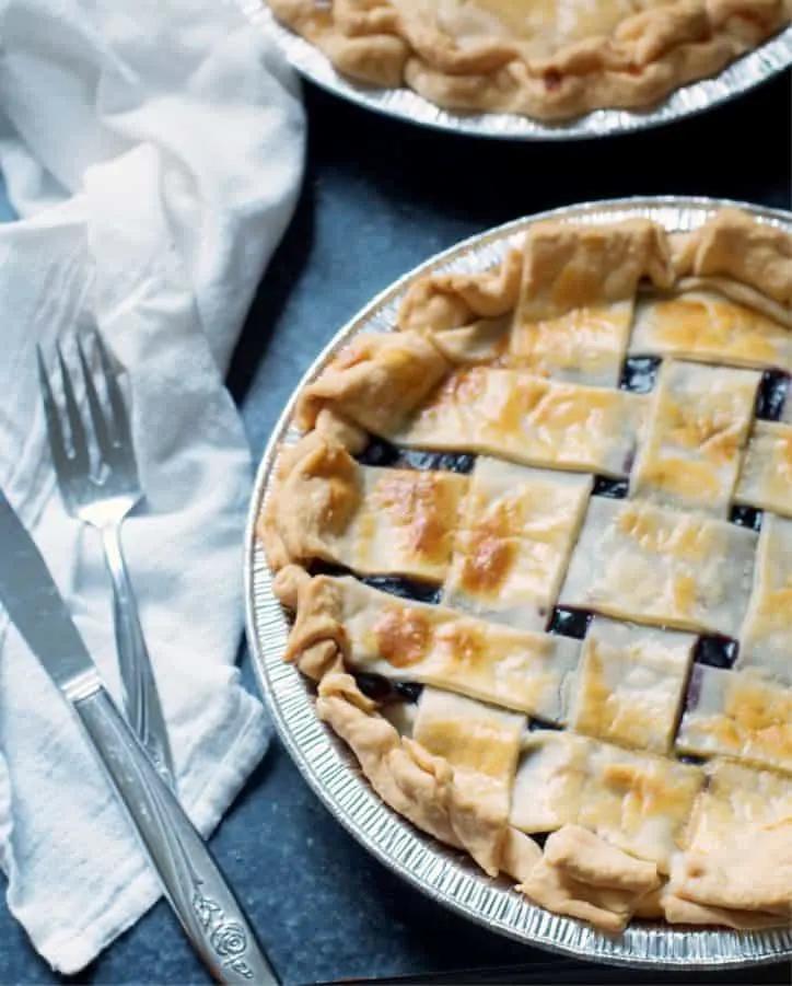 A blueberry pie with a fork for How to Make Blueberry Pie with Blueberry Pie Filling