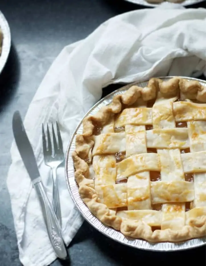 An overhead view of a pie with a fork and knife with How to Make Apple Pie with Apple Pie Filling