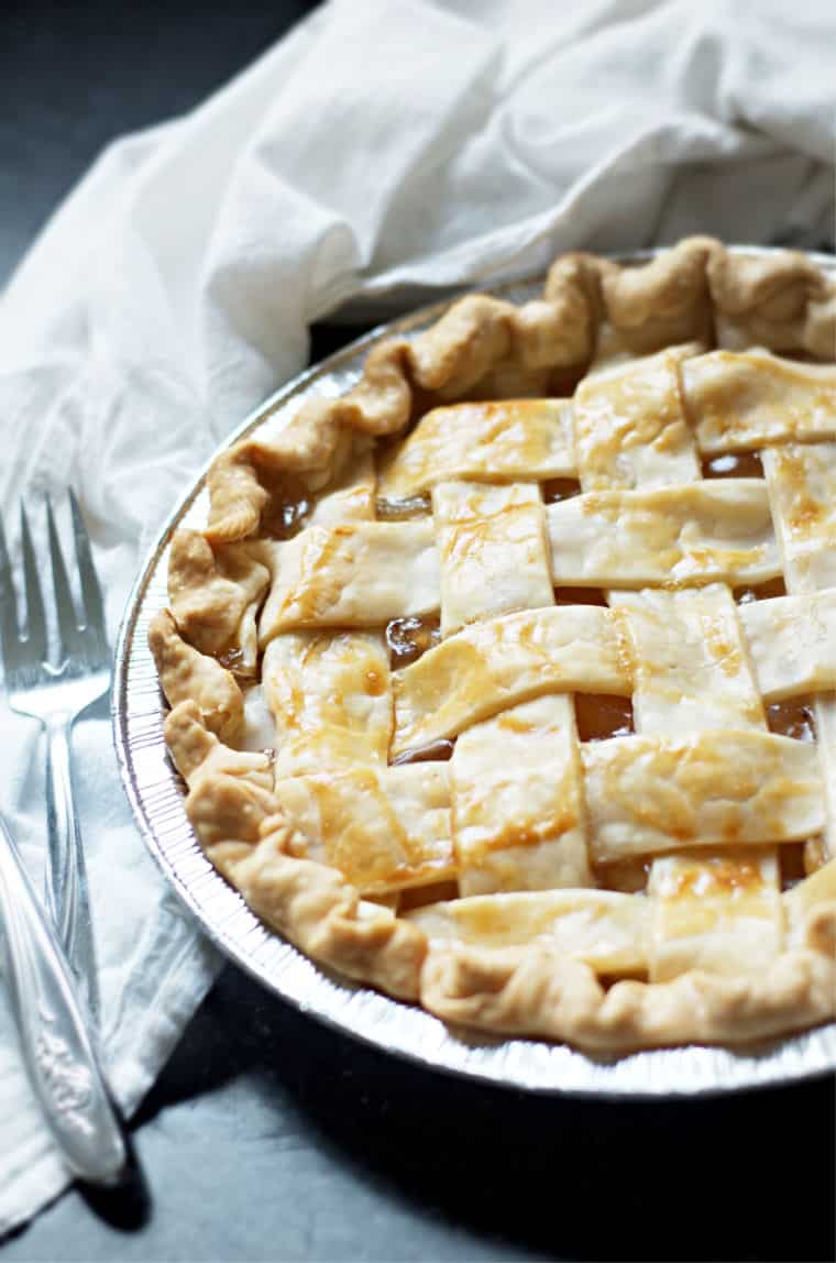 A view of a whole pie and a fork with How to Make Apple Pie with Apple Pie Filling