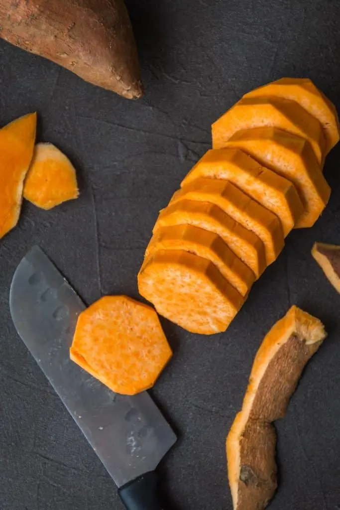 Cut sweet potatoes for sweet potato cobbler