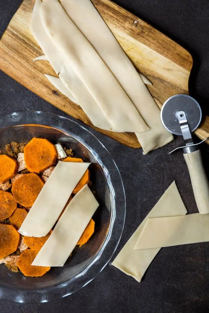 The beginning of the layering process for sweet potato cobbler