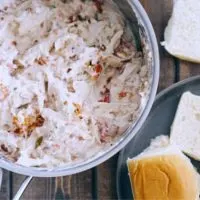 A bowl of White Trash Chicken Sliders ready for sandwiches