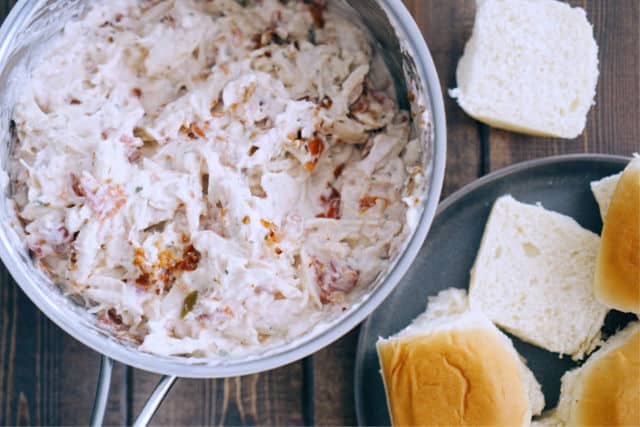 chicken bacon, cream cheese, chilis all mixed together in a bowl