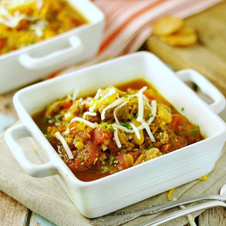 bowl of chili on table with spoon