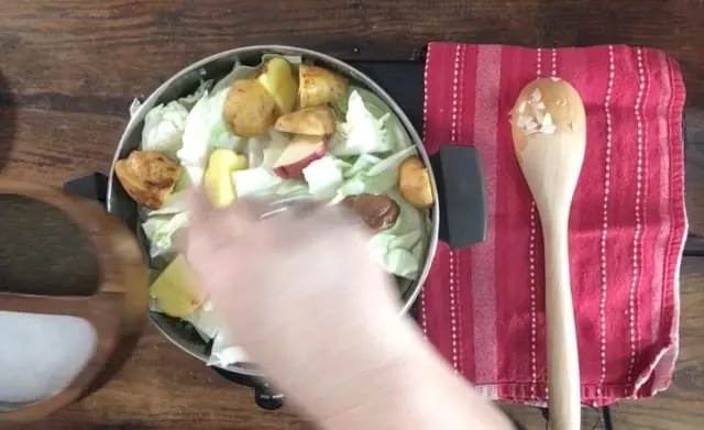 Adding the potatoes to the stockpot