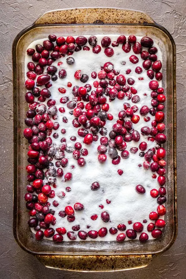 The cranberries and sugar in the roasting pan