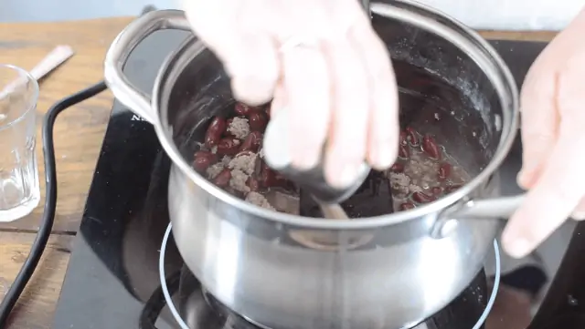 Adding the spices to the sauce pan