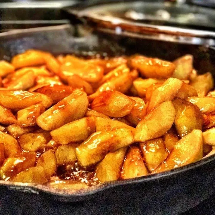 a skillet of fried apples cooking