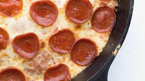 A photo of a pizza in a cast iron skillet recipe